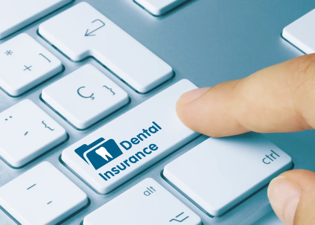 clicking dental insurance button on a keyboard