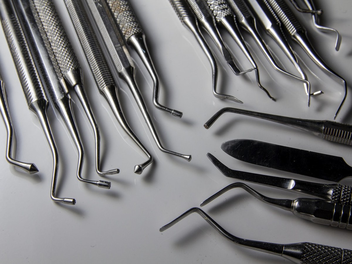 Dental instruments laid out in a row