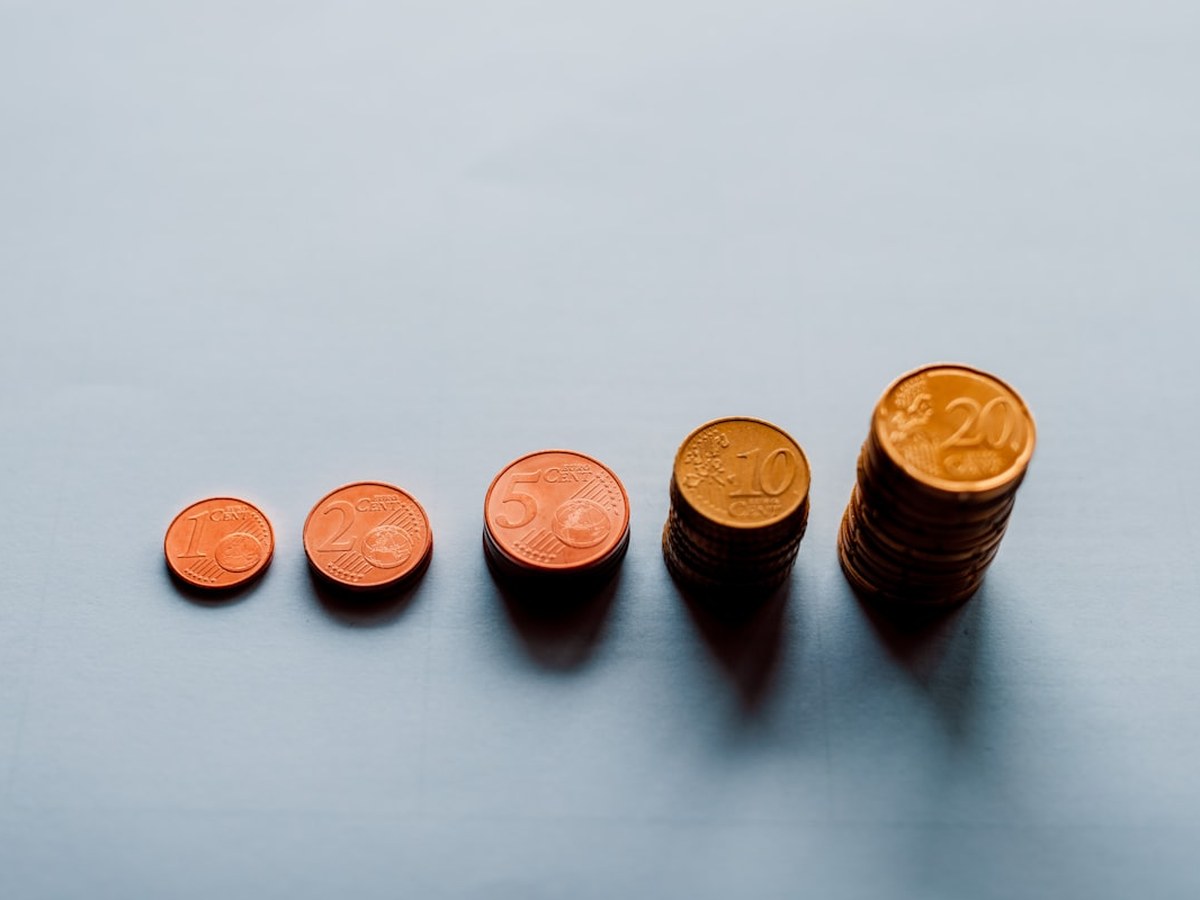 Coins stacked in rising columns to represent varying treatment cost